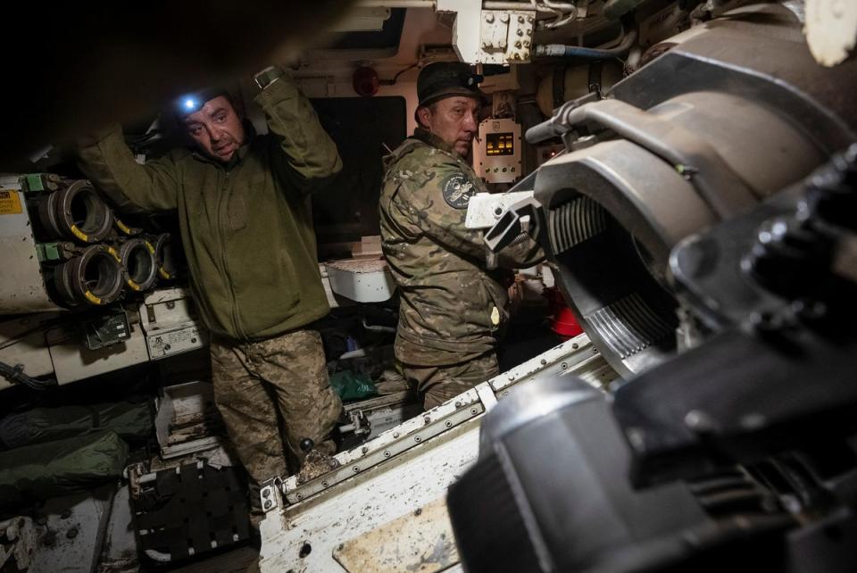 Ukrainian servicemen of the 92nd separate assault brigade prepare a M109 self-propelled howitzer to fire towards Russian troops near the town of Vovchansk in Kharkiv region (REUTERS)