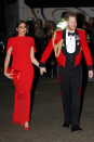 <p>The Duke and Duchess arrived at the Royal Albert Hall in <a href="https://www.cosmopolitan.com/uk/fashion/a31272151/megan-markle-prince-harry-matched-outfits-in-best-way/" rel="nofollow noopener" target="_blank" data-ylk="slk:matching red looks;elm:context_link;itc:0;sec:content-canvas" class="link ">matching red looks</a>, with Meghan sporting a Safiyaa cape dress teamed with matching Stuart Weitzman shoes and a Manolo Blahnik clutch.</p>