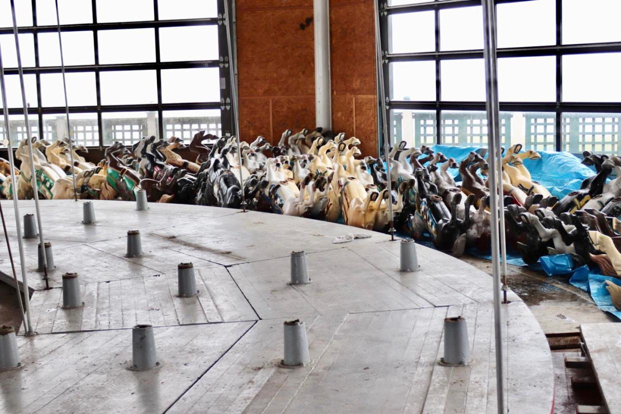 A sea of horses from the carousel are stacked upside down inside the rotunda at Easton's Beach.