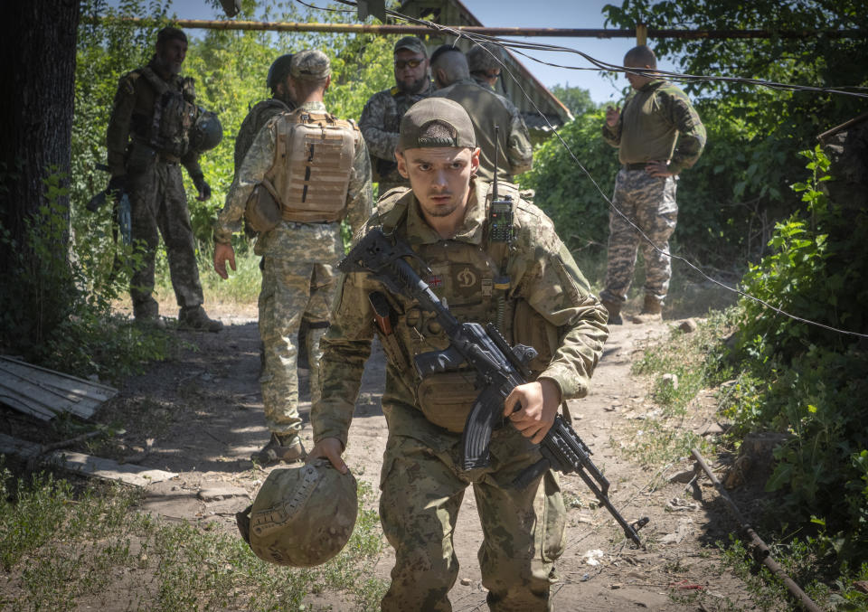 FILE - Ukrainian soldiers attend their positions, in the Donetsk region, Ukraine, Saturday, July 2, 2022. As the war slogs on, a growing flow of Western weapons over the summer is now playing a key role in the counteroffensive, helping Ukraine significantly boost its precision strike capability. (AP Photo/Efrem Lukatsky, File)