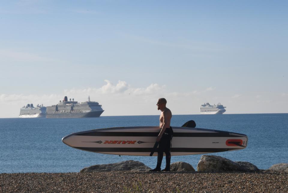 Ships without passengers have been moored around the world, including near Weymouth, Dorset (pictured) - BNPS