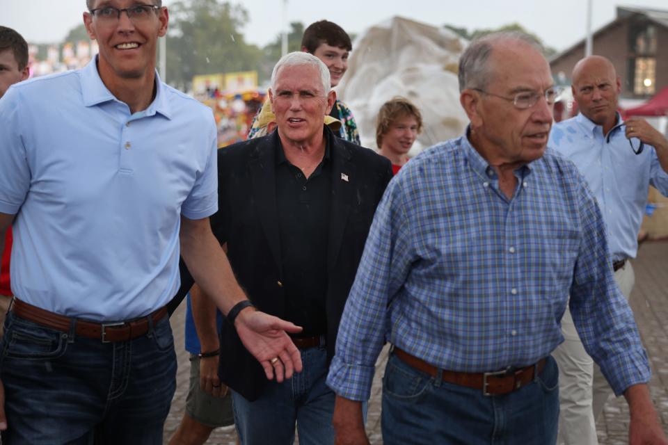 Former Vice President Mike Pence tours the Iowa State Fair with Sen. Chuck Grassley, R-Iowa, on Aug. 19 in Des Moines.