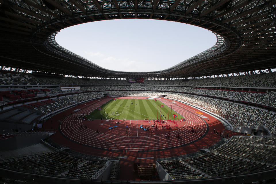 FILE - This May 9, 2021, file photo shows a general view of National Stadium during an athletics test event for the Tokyo 2020 Olympics Games in Tokyo. The Tokyo Olympics, already delayed by the pandemic, are not looking like much fun: Not for athletes. Not for fans. And not for the Japanese public, who are caught between concerns about the coronavirus at a time when few are vaccinated on one side and politicians who hope to save face by holding the games and the International Olympic Committee with billions of dollars on the line on the other. (AP Photo/Shuji Kajiyama, File)