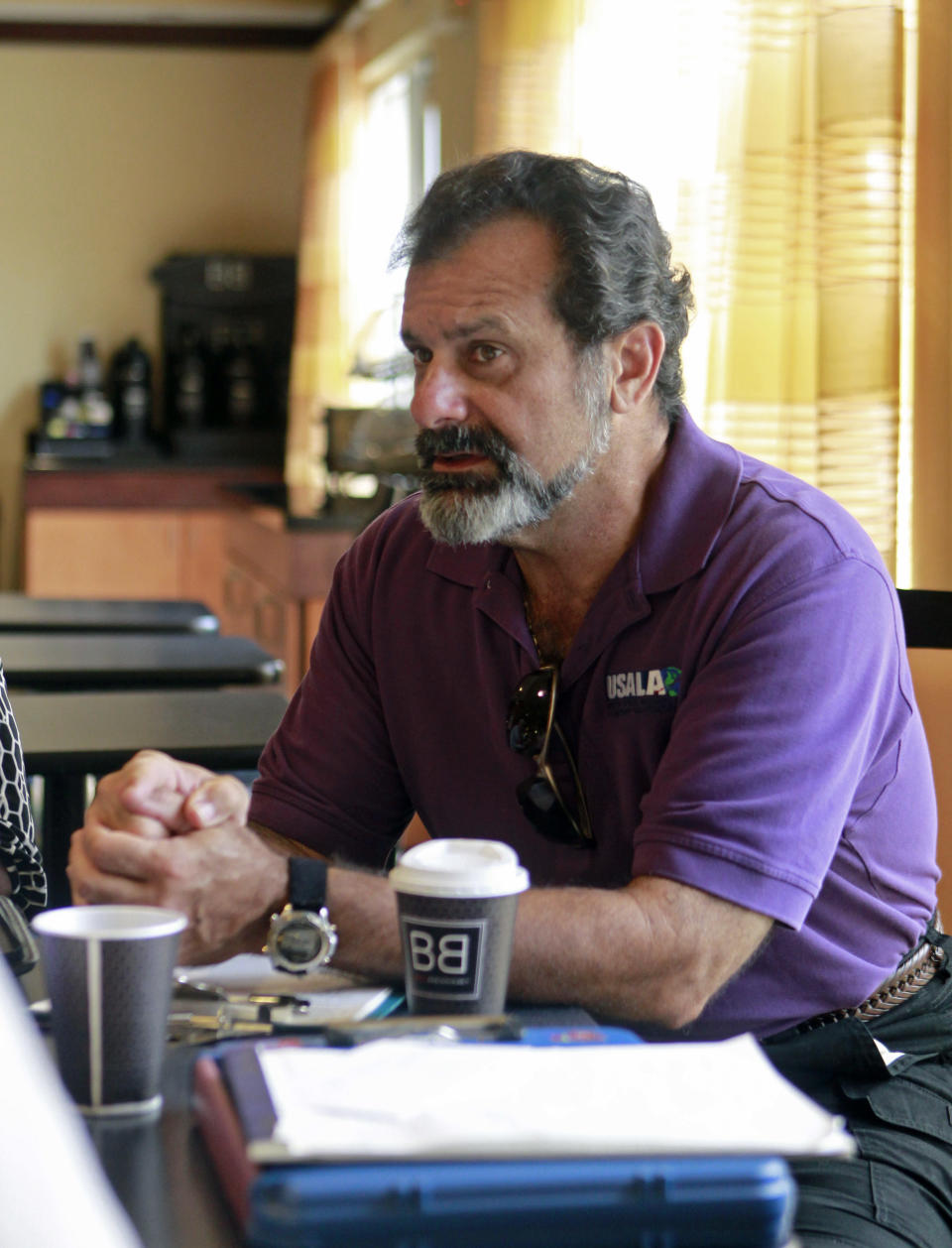 In this Wednesday, July 11, 2012 photo, former space shuttle worker Kevin Harrington attends a business development meeting, in Titusville, Fla. Harrington previously worked on the shuttles' thermal protection system before he was laid off. (AP Photo/John Raoux)