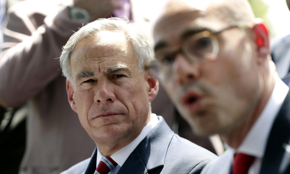 Texas Governor Greg Abbott, left, listens as Speaker of the House Dennis Bonnen, right, answers a question during a joint news conference to discuss teacher pay and school finance at the Texas Governor's Mansion in Austin, Texas, Thursday, May 23, 2019, in Austin. Texas Gov. Greg Abbott says $1.6 billion in teacher raises are coming in a deal driven by classroom unrest and Republicans who sharply changed course on public education ahead of 2020. (AP Photo/Eric Gay)