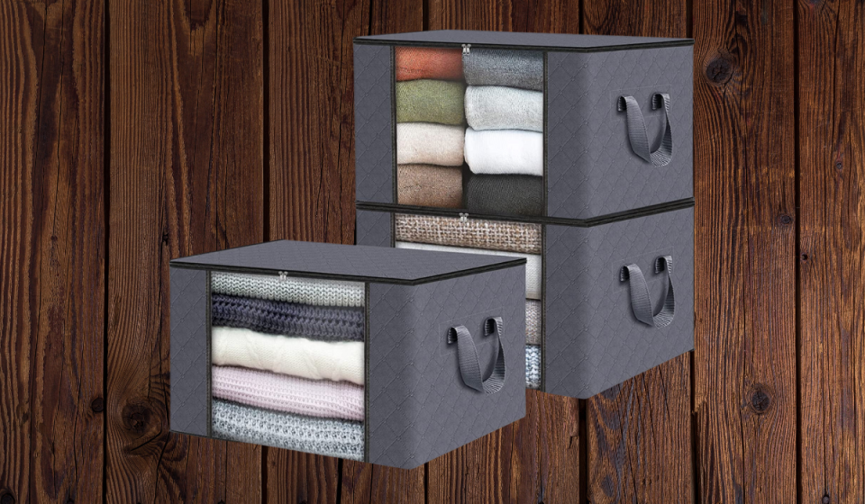 grey storage totes with clothes inside