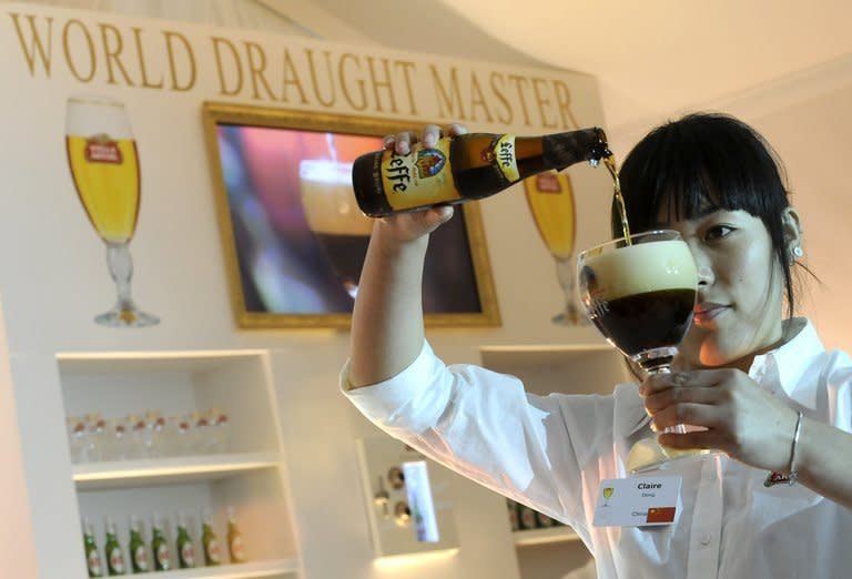 Claire Dong from China pours a beer at the World Draught Master event in Leuven, Belgium in 2008. Belgium's centuries-old beers, product of the tiny country's location at a culinary and cultural crossroads between north and southern Europe, are taking the world's tipplers by storm