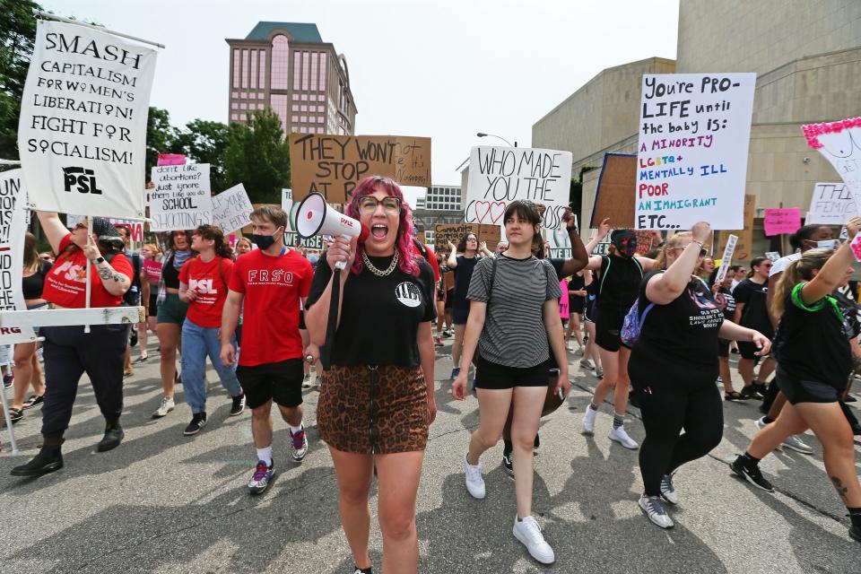 Carly Klein, center,  from Milwaukee Alliance Against Racist & Political Repression, helps lead a crowd of several hundred during the “People’s Independence Day: Fight for our rights, repeal Wisconsin abortion ban”, rally down W. State Street on Monday, July 4, 2022.