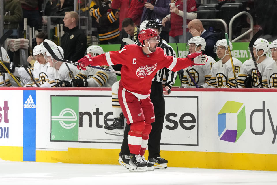 Detroit Red Wings center Dylan Larkin, left, reacts after scoring a goal during the third period of an NHL hockey game against the Boston Bruins, Saturday, Nov. 4, 2023, in Detroit. (AP Photo/Carlos Osorio)