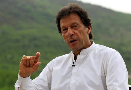 Imran Khan, chairman of the Pakistan Tehreek-e-Insaf (PTI) political party, speaks with a Reuters correspondent during an interview at his home in the hills of Bani Gala on the outskirts of Islamabad, Pakistan July 29, 2017. REUTERS/Caren Firouz