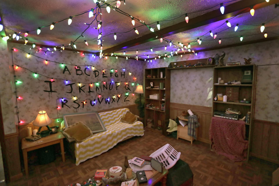 In this Wednesday, Sept. 12, 2018 photo, the Beyers' home living room from the TV show Stranger Thing is recreated in this haunted house for Halloween Horror nights at Universal Studios in Orlando, Fla. The “Stranger Things” house is one of 10 haunted houses built for this year’s Halloween Horror Nights running through early November. (AP Photo/John Raoux)