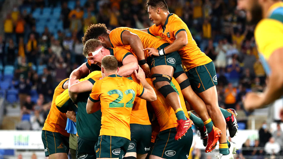 The Wallabies were elated after Quade Cooper's penalty goal earned them a 28-26 win over South Africa. (Photo by Chris Hyde/Getty Images)