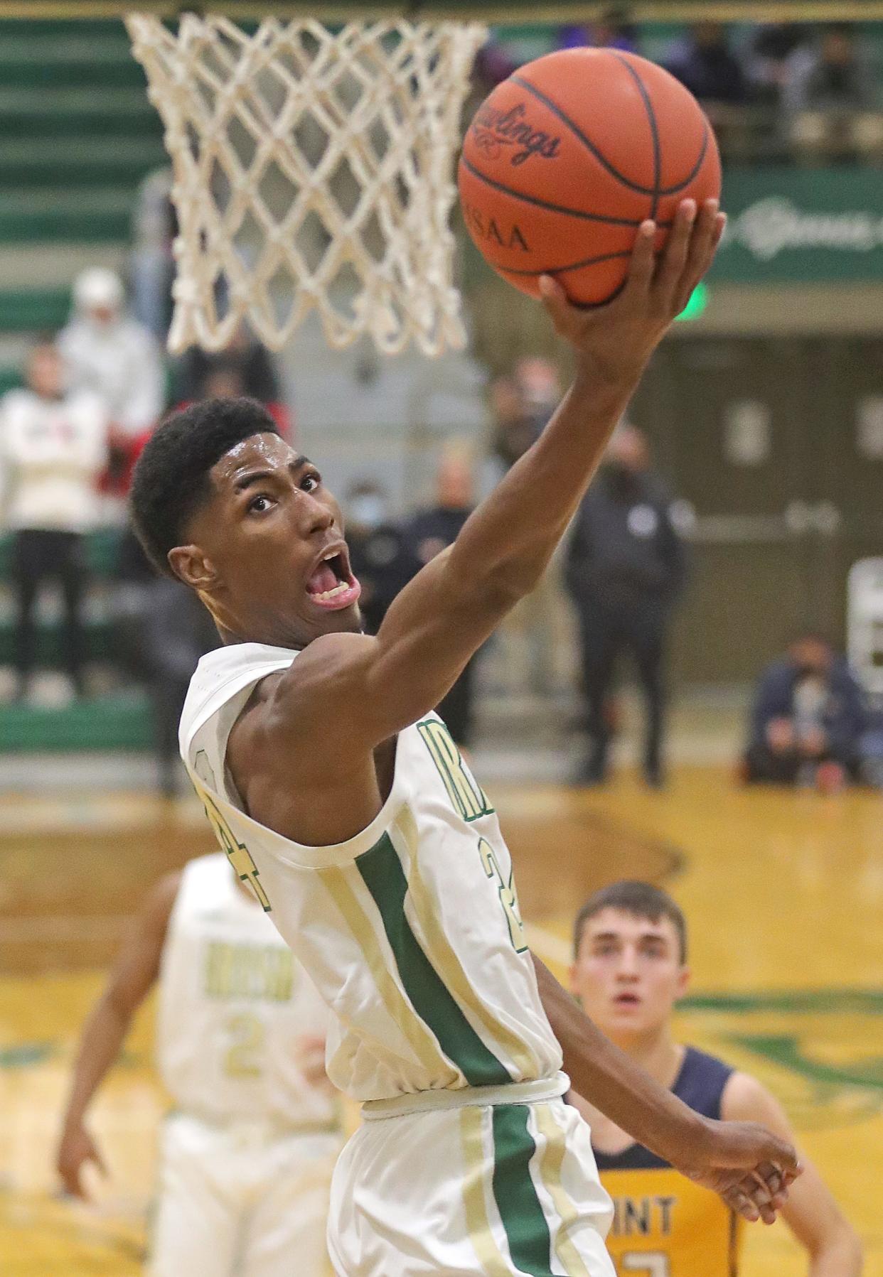 St. Vincent-St. Mary's Sencire Harris goes up for two of his game-high 29 points in a 56-38 win over Cleveland St. Ignatius on Thursday night at LeBron James Arena. [Phil Masturzo/Beacon Journal]