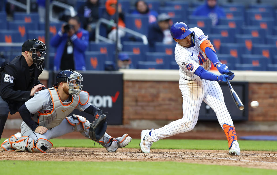 New York Mets' Tyrone Taylor, right, hits a walkoff single against the Detroit Tigers during the ninth inning in the second game of a baseball doubleheader, Thursday, April 4, 2024, in New York. (AP Photo/Noah K. Murray)