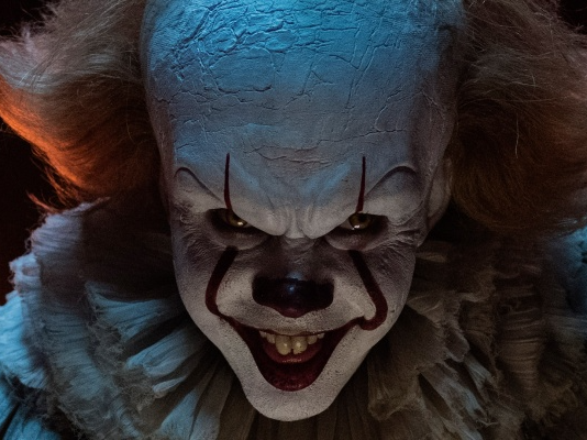 A Man Costumed as Pennywise Making Scary Face Reaction · Free Stock Photo