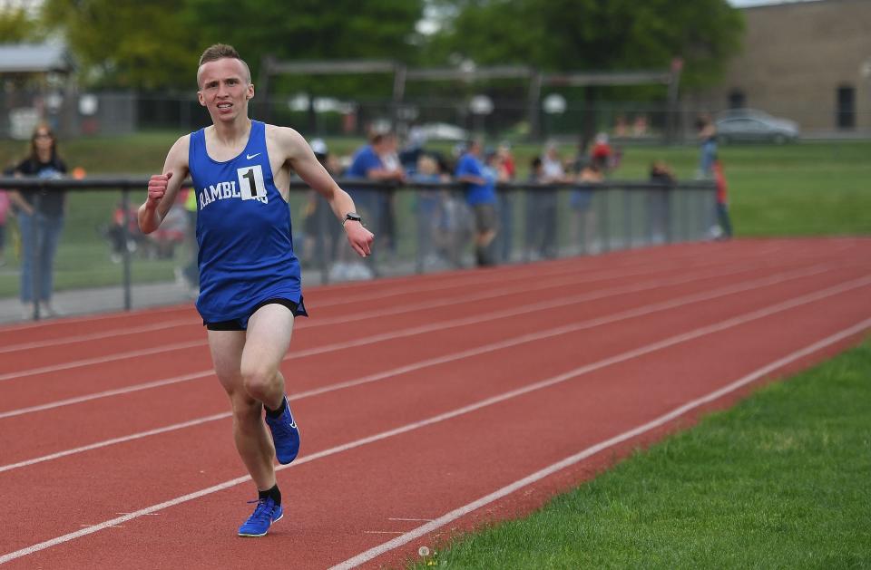 Windber's Joseph McKelvey heads towards the finish line with no competitors in sight to win the boys' 1600 meter run in a time of 4:43.85 at the Inter-County Conference track and field championships, May 6, in Loysburg.