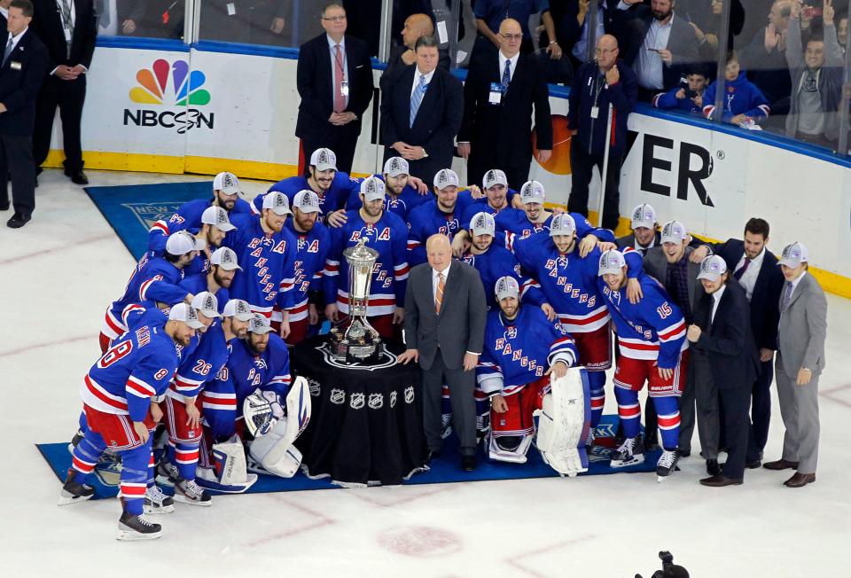 May 29, 2014; New York, NY, USA; The New York Rangers pose with the Prince of Wales Trophy after beating the Montreal Canadiens 1-0 in game six of the Eastern Conference Final of the 2014 Stanley Cup Playoffs at Madison Square Garden. Mandatory Credit: Andy Marlin-USA TODAY Sports