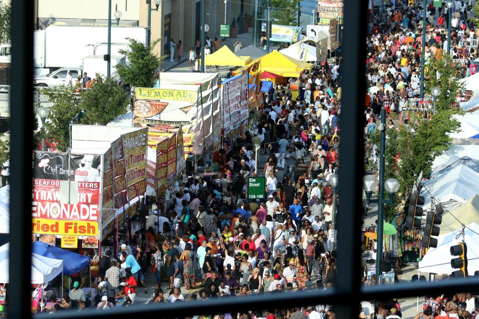 Freedom Way at Elm Street is packed with vendors and people for the Cincinnati Music Festival outside of Paul Brown Stadium Friday, July 22, 2016.