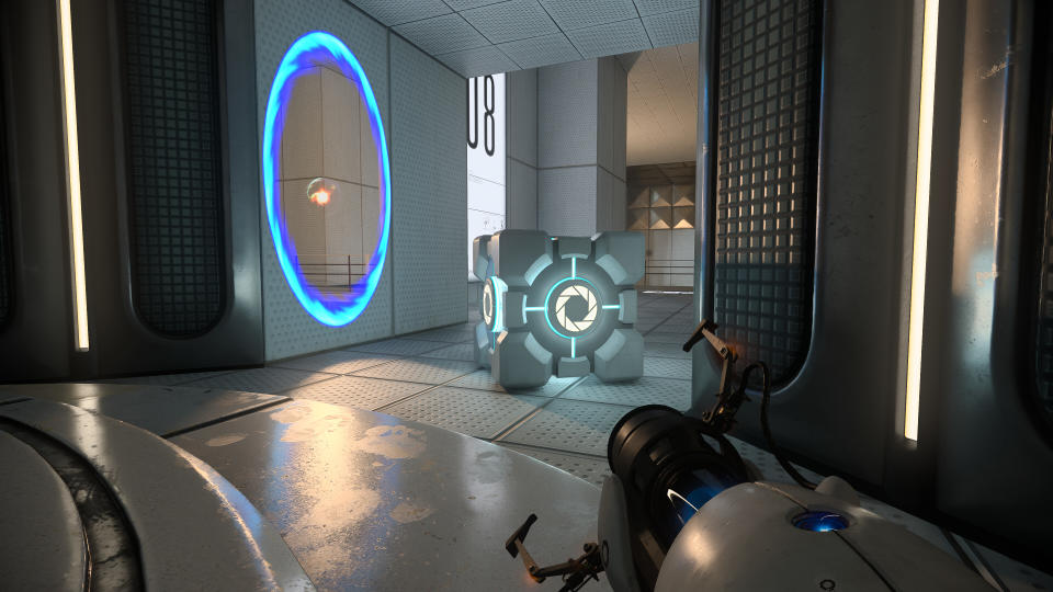 Screenshot of Portal with RTX on. A blue portal with an orb of light emerging from it can be seen in a corridor with a Weighted Test Cube in front of it.