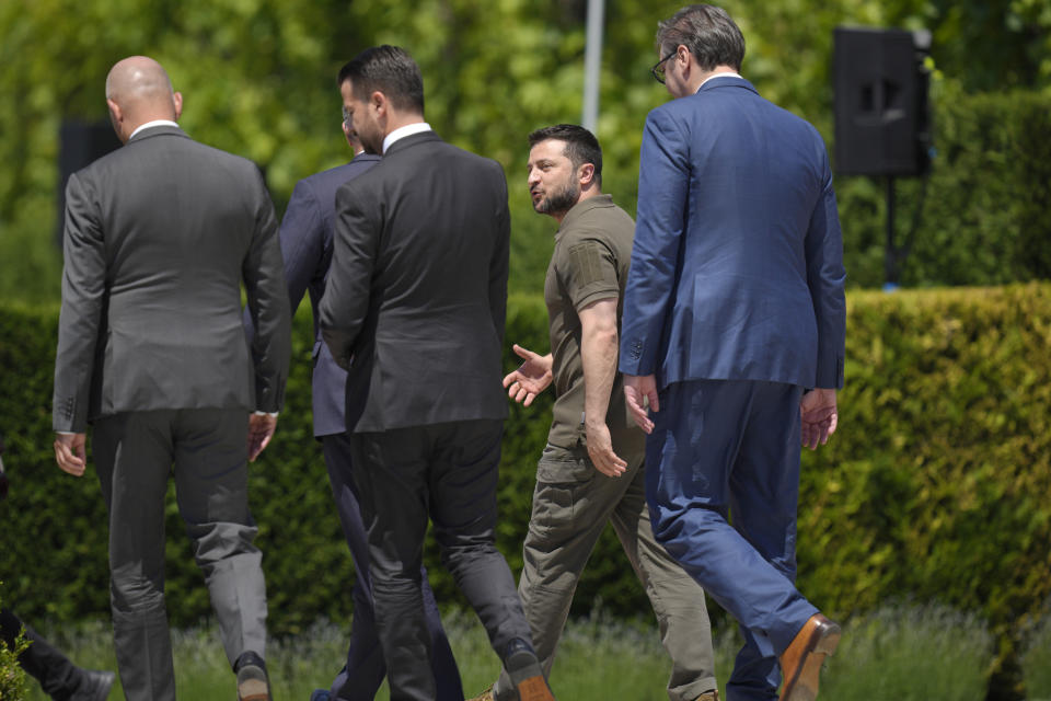 Ukraine's President Volodymyr Zelenskyy, second right, walks with Serbia's President Aleksandar Vucic, right, during the European Political Community Summit at the Mimi Castle in Bulboaca, Moldova, Thursday, June 1, 2023. Leaders are meeting in Moldova Thursday for a summit aiming to show a united front in the face of Russia's war in Ukraine and underscore support for the Eastern European country's ambitions to draw closer to the West and keep Moscow at bay. (AP Photo/Vadim Ghirda)