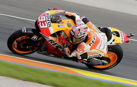 Honda MotoGP rider Marc Marquez of Spain races during the third free practice session ahead of the Valencia Motorcycle Grand Prix at the Ricardo Tormo racetrack in Cheste, near Valencia, November 8, 2014. REUTERS/Heino Kalis