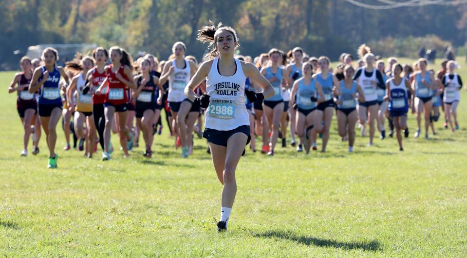 Daphne Banino from The Ursuline School leads the pack at the start of the girls Section One Class A cross country championships at Bowdoin Park in Wappingers Falls, Nov. 6, 2021. 