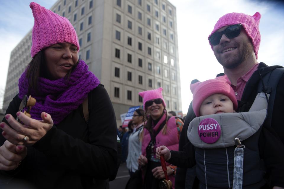 Rachel and Jordan Roth march with their son, George, at the Women’s March in Denver. (Photo: Getty Images)