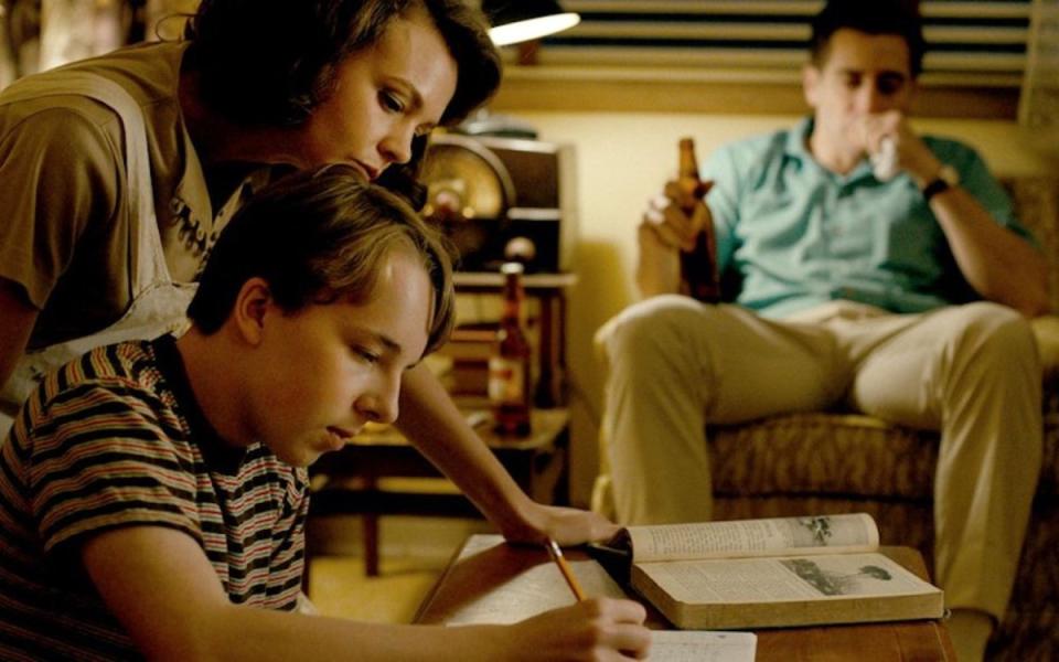 Carey Mulligan, Ed Oxenbould and Jake Gyllenhaal in Paul Dano's directorial debut WILDLIFE <p>Focus Features</p>