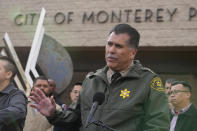 Los Angeles County Sheriff Robert Luna takes questions from the media outside the Civic Center in Monterey Park, Calif., Sunday, Jan. 22, 2023. At left, CA-D Rep. Judy Chu, and Monterrey Park Mayor Henry Lo. A mass shooting took place at a dance club following a Lunar New Year celebration, setting off a manhunt for the suspect. (AP Photo/Damian Dovarganes)