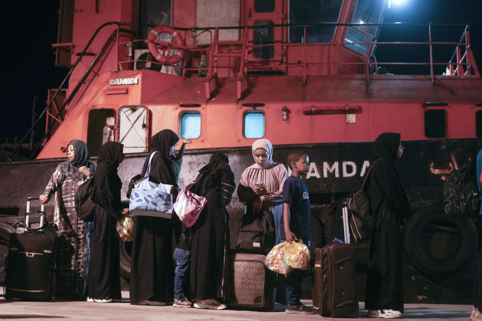 Sudanese evacuees wait before boarding a Saudi military ship to Jeddah port, at Port Sudan in Sudan, Wednesday, May 3, 2023. Many are fleeing the conflict in Sudan between the military and a rival paramilitary force. (AP Photo/Amr Nabil)