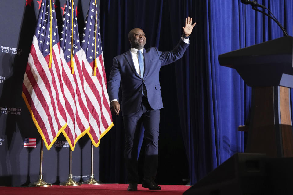 Sen. Tim Scott, R-S.C., walks onto stage before Republican presidential candidate former President Donald Trump at a campaign rally at Charleston Area Convention Center in North Charleston, S.C., Wednesday, Feb. 14, 2024. (AP Photo/David Yeazell)