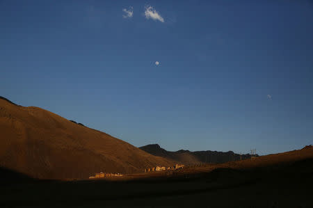 A view of the moon over the town of Nueva Fuerabamba in Apurimac, Peru, October 3, 2017. REUTERS/Mariana Bazo