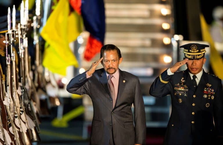 Brunei’s Sultan Hassanal Bolkiah (C) caused controversy in 2014 when he introduced sharia law to the tiny, oil-rich nation