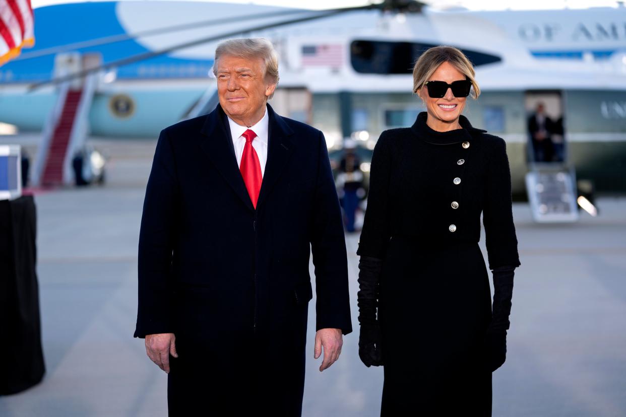 <p>Donald Trump, left, and US First Lady Melania Trump, arrive to a farewell ceremony at Joint Base Andrews, Maryland, on 20 January 2021</p> ((EPA))