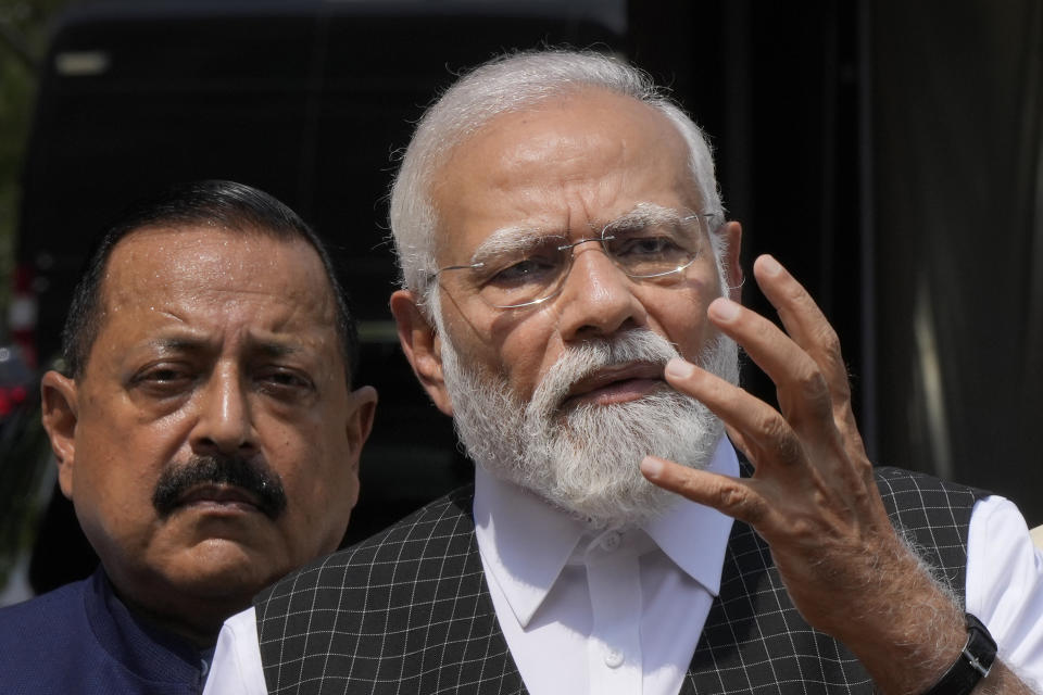 Indian Prime Minister Narendra Modi speaks as he arrives on the opening day of the monsoon session of the Indian parliament in New Delhi, India, Thursday, July 20, 2023. Modi Thursday broke more than two months of his public silence over the deadly ethnic clashes that have marred the country's remote northeast Manipur state, a day after a viral video showed two women being paraded naked by a mob, sparking outrage across the nation. (AP Photo/Manish Swarup)