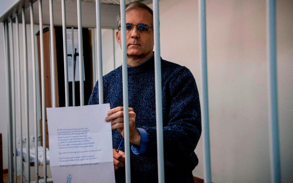 Paul Whelan, a former US Marine accused of espionage and arrested in Russia in December 2018, standing inside a defendants' cage during a hearing in 2019 - DIMITAR DILKOFF /AFP