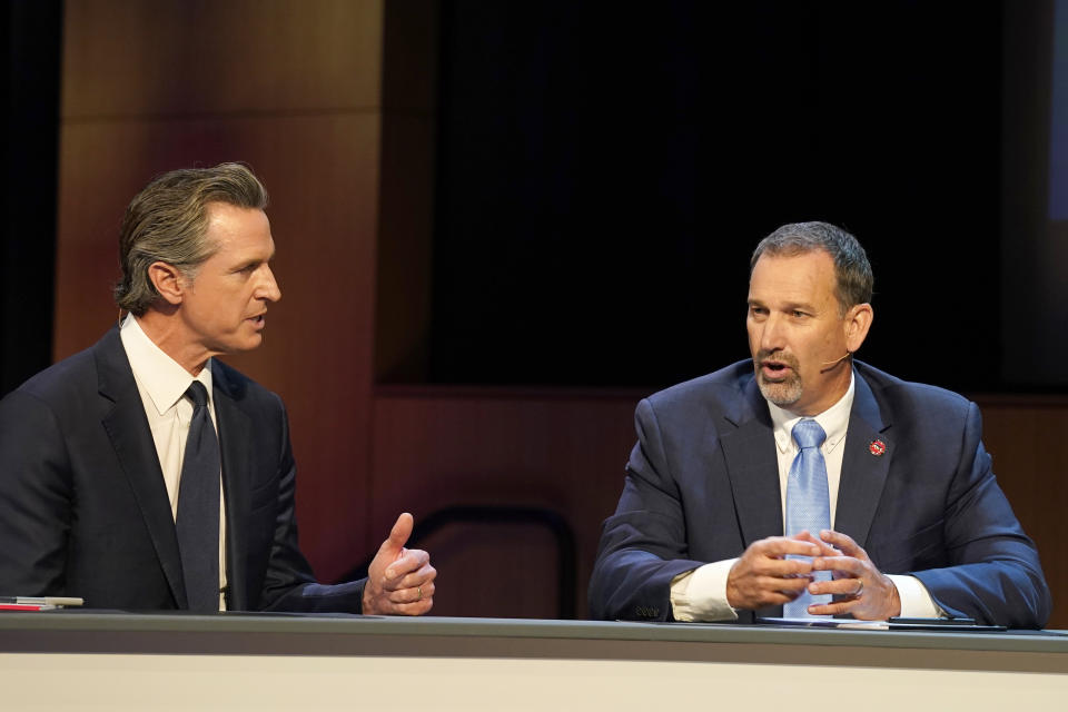 Gubernatorial candidates Democratic Gov. Gavin Newsom, left, and Republican challenger state Sen. Brian Dahle spar during their debate held by KQED Public Television in San Francisco, on Sunday, Oct. 23, 2022. (AP Photo/Rich Pedroncelli, Pool)