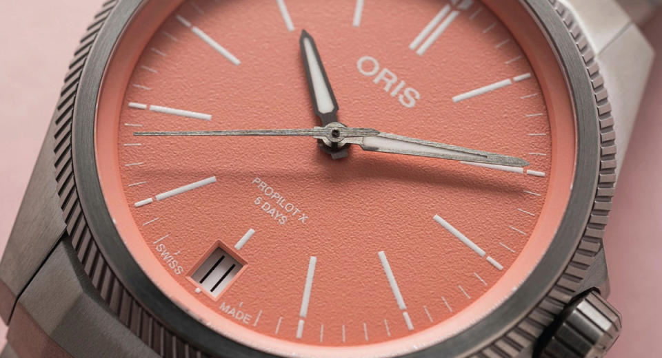 Oris liberally calls the dial in this ProPilot X “salmon-dialed,” but the color is more cotton-candy pink and the caoting is textured paint. In person, this dial has none of the depth or iridescence of a proper gilded dial.