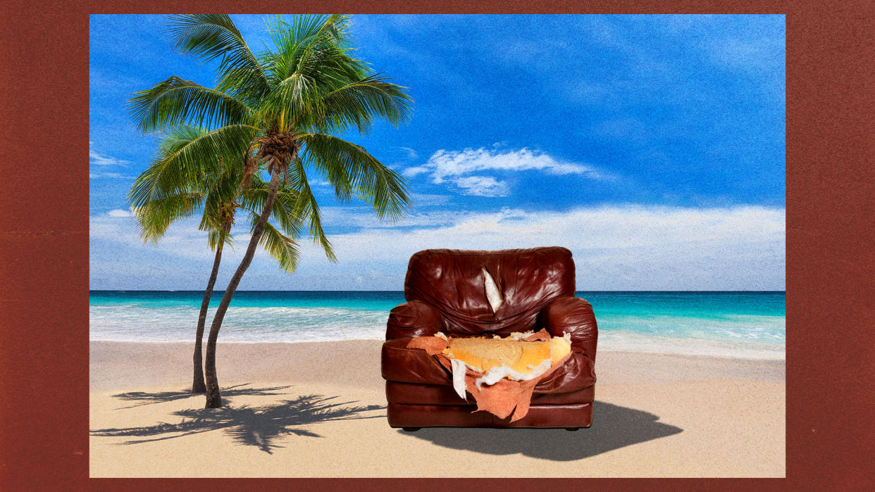 A photo illustration shows a torn-up leather armchair near a palm tree on a beach.