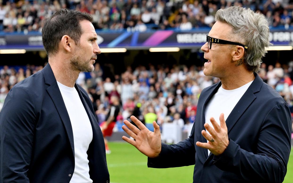 Robbie Williams debuted a mullet-esque style for his grey hair at the Soccer Aid match on June 9