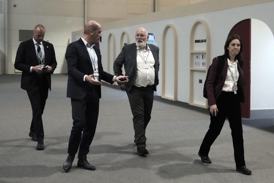 Frans Timmermans, executive vice president of the European Commission, second from right, walks through the COP27 U.N. Climate Summit, Friday, Nov. 18, 2022, in Sharm el-Sheikh, Egypt. (AP Photo/Nariman El-Mofty)