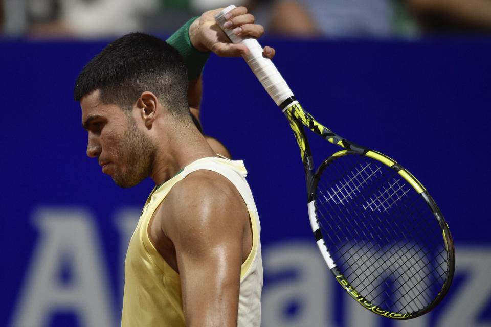 Carlos Alcaraz, of Spain, reacts after missing a point during an Argentina Open ATP semifinal tennis match against Nicolas Jarry, of Chile, at the Guillermo Vilas Stadium, in Buenos Aires, Argentina, Saturday, Feb. 17, 2024. (AP Photo/Gustavo Garello)