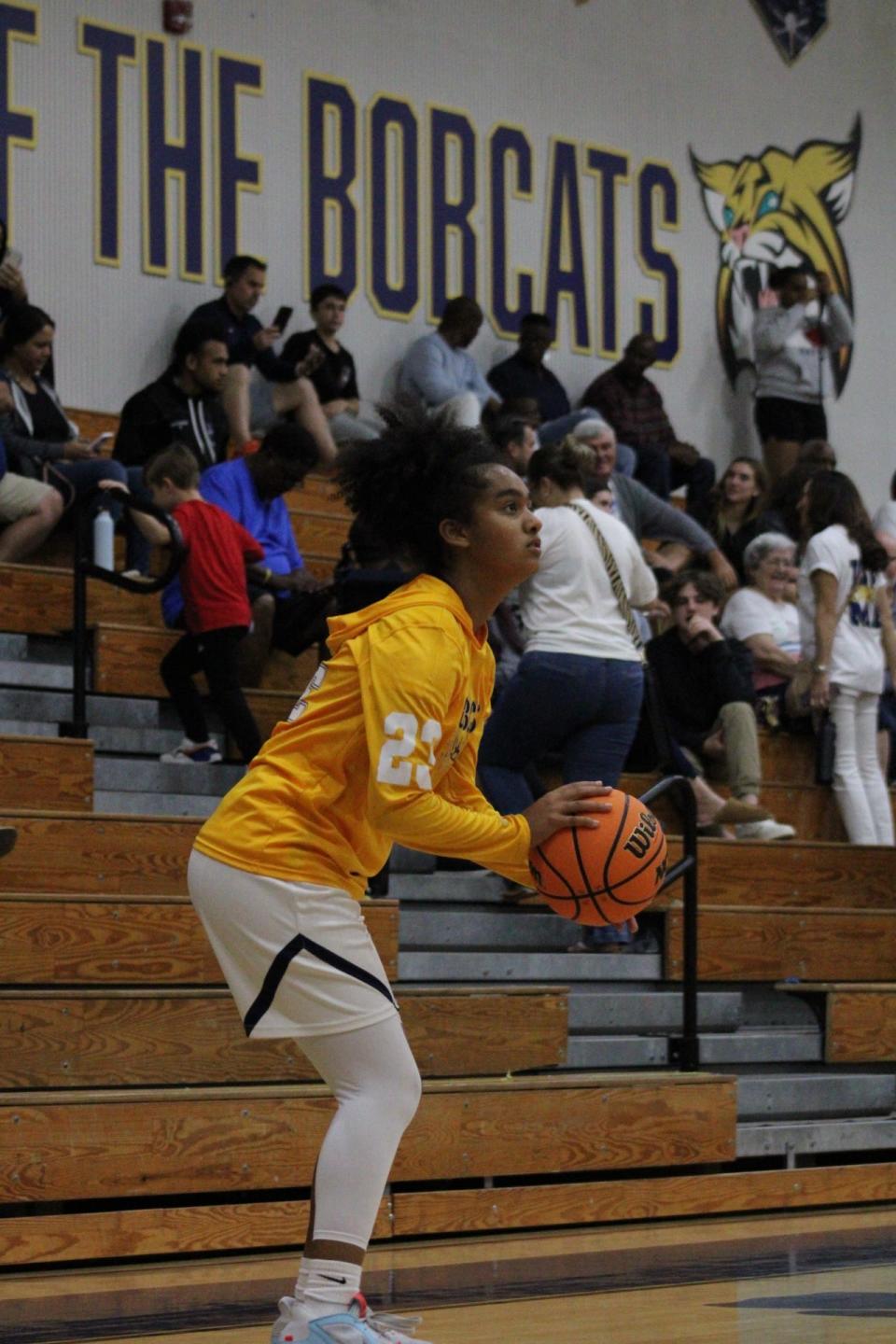 Freshman Tatyana Campise-Pinkney warming-up before regional quarter final contest against Park Vista.