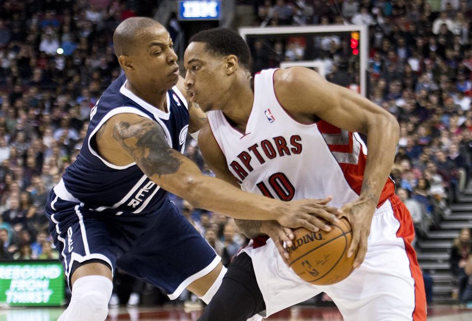 Toronto Raptors forward DeMar DeRozan, right, guards the ball against Oklahoma Thunder forward Caron Butler during the first half of an NBA basketball game in Toronto on Friday, March 21, 2014. (AP Photo/The Canadian Press, Nathan Denette)