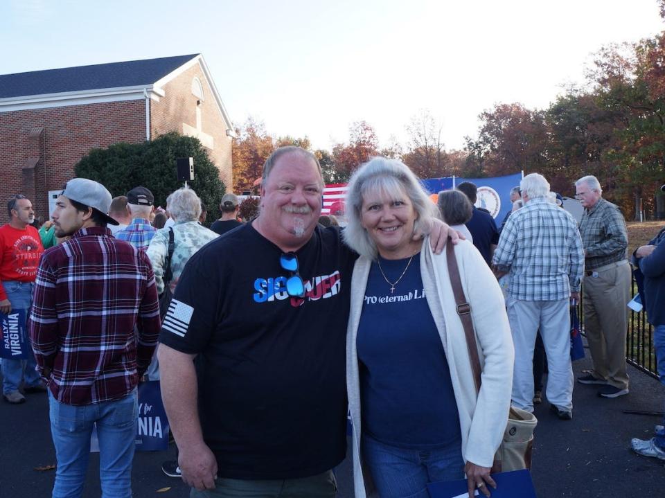 Susie and Todd Woollam pose at a Yesli Vega rally in Spotsylvania, VA.