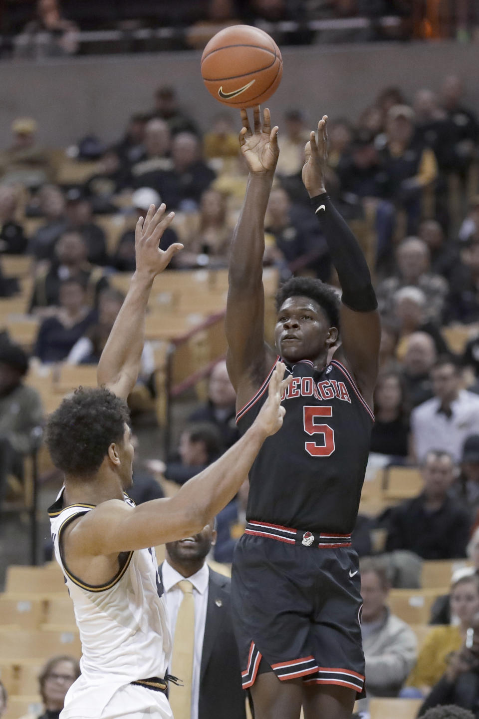 Georgia's Anthony Edwards (5) shoots over Missouri's Mark Smith during the first half of an NCAA college basketball game Tuesday, Jan. 28, 2020, in Columbia, Mo. (AP Photo/Jeff Roberson)