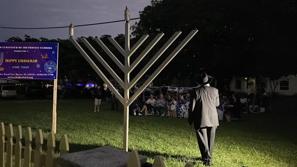 Rabbi Yitzchok Minkowicz of Chabad Lubavitch speaks to those gathered to watch the lighting of a menorah Sunday along McGregor Boulevard heralding the start of the eight-day Jewish holiday of Hanukkah. The menorah is on property the Chabad recently purchased along McGregor and abutting its Winkler Road property.