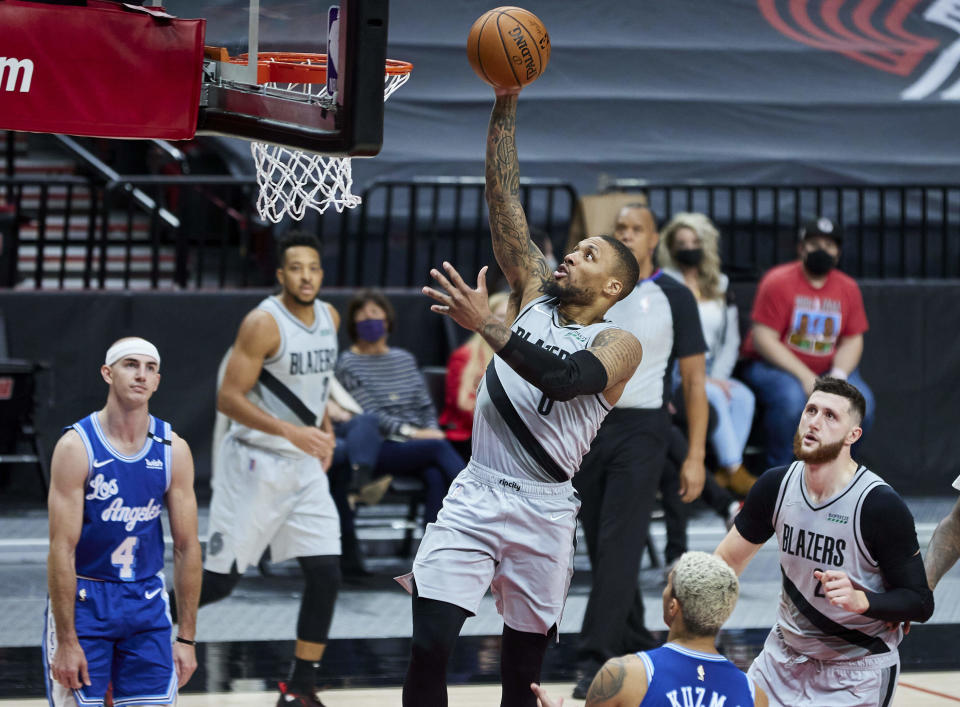 Portland Trail Blazers guard Damian Lillard shoots against the Los Angeles Lakers during the second half of an NBA basketball game in Portland, Ore., Friday, May 7, 2021. (AP Photo/Craig Mitchelldyer)