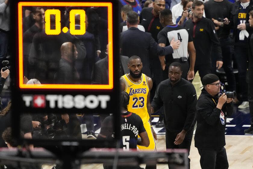 Los Angeles Lakers forward LeBron James (23) walks off the court after a loss to the Denver Nuggets.