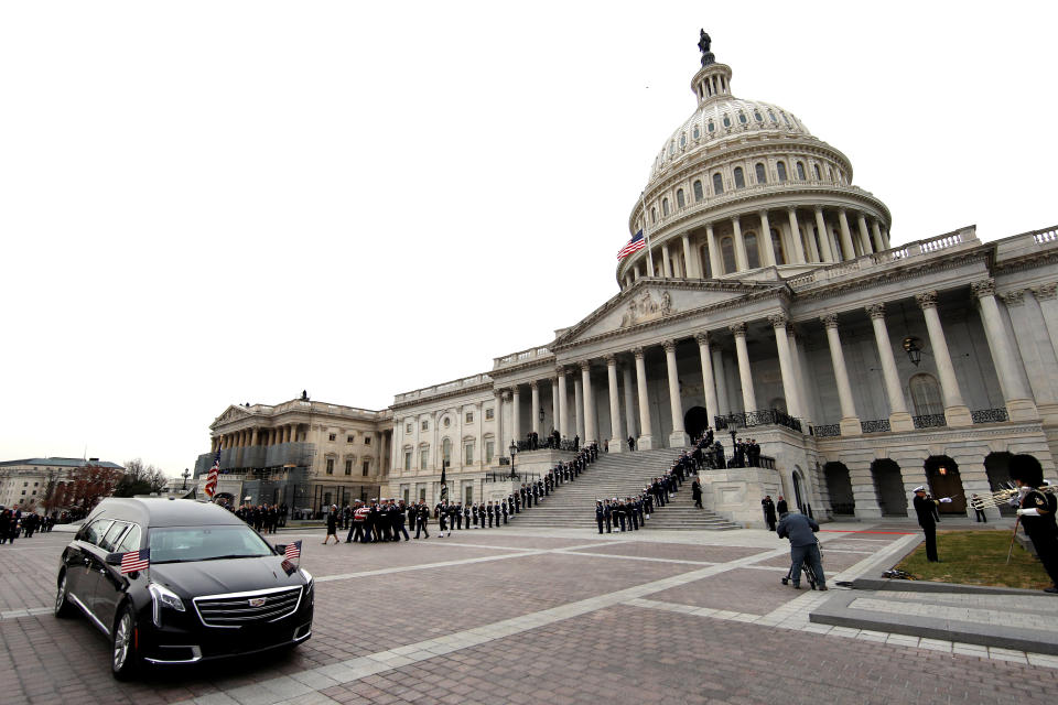 The flag-draped casket of former President George H.W. Bush is carried by a joint services military honor guard from the U.S. Capitol, Wednesday, Dec. 5, 2018, in Washington. (Photo: Alex Brandon/Pool via Reuters)